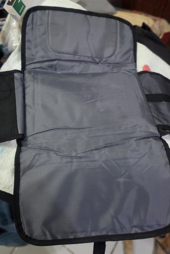 Diaper Changing Pad (Category: Changing Mats & Accessories) located in Quezon City. Submitted by lois_bns (Listing ID 1458276040, Image 2). Description: Unused baby diaper changing pad. Black in color, big/wide in size. With wet wipes and diaper side slot. Good for travel. Can send videos as well..