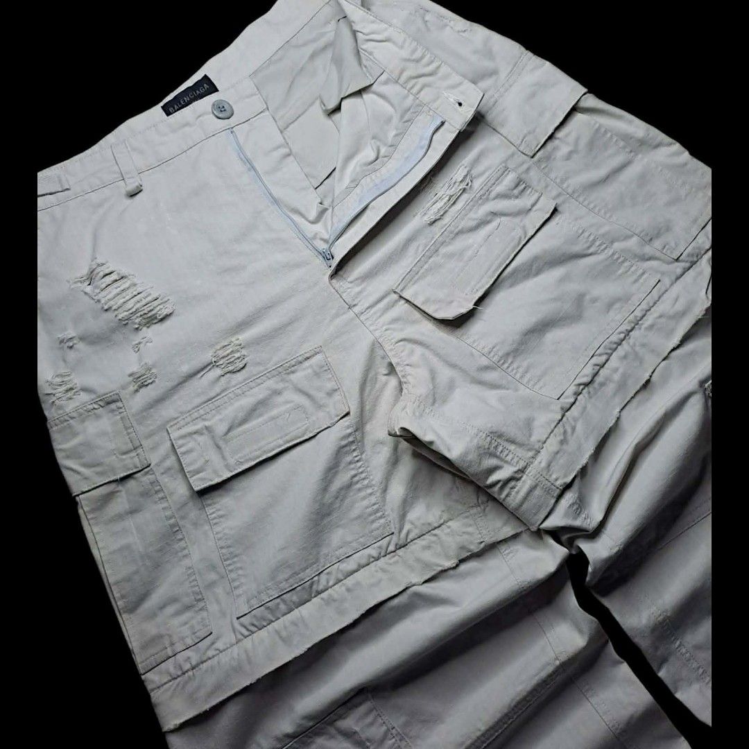 Balenciaga Convertible Cargo (Category: Luxury Apparel) located in Manila. Submitted by yaseen_73 (Listing ID 1458179696, Image 2). Description: Balenciaga Distressed Large Cargo Pants in light grey/beige cotton ripstop with heavy ripped and destroyed detailing - Medium - Waistline 34 Adjustbale - Front Thigh 15½ - Front Rise 16 - Leg Opening 12 - Length 44 - As New - Pre Owned or Best Offer ✅GCash Ready ❎COD 🛵Lalamove 🚚J&T Seller's Location : 