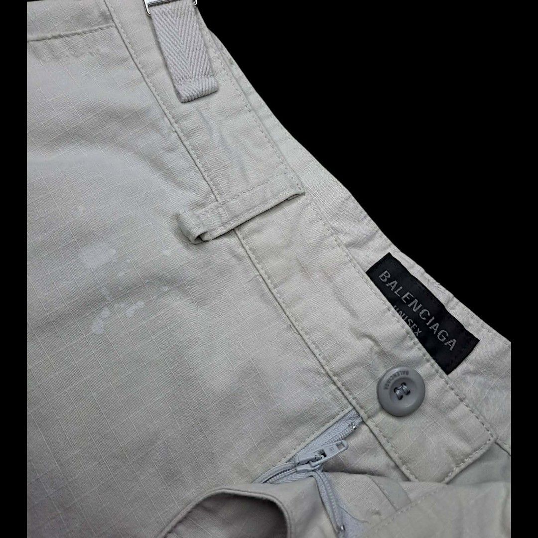 Balenciaga Convertible Cargo (Category: Luxury Apparel) located in Manila. Submitted by yaseen_73 (Listing ID 1458179696, Image 3). Description: Balenciaga Distressed Large Cargo Pants in light grey/beige cotton ripstop with heavy ripped and destroyed detailing - Medium - Waistline 34 Adjustbale - Front Thigh 15½ - Front Rise 16 - Leg Opening 12 - Length 44 - As New - Pre Owned or Best Offer ✅GCash Ready ❎COD 🛵Lalamove 🚚J&T Seller's Location : 
