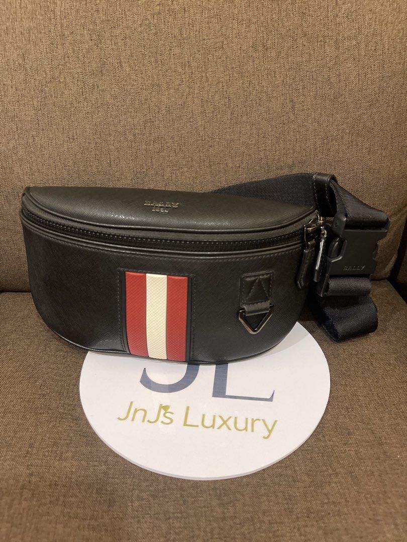 Bally Black Leather Bumbag with Red & White Stripe (Category: Luxury Bags & Wallets) located in Manila. Submitted by jnjsluxury (Listing ID 1458170532, Image 3). Description: - Authentic Bally bumbag - Color: Black leather - Features signature Bally stripe detail - Adjustable strap with branded buckle - Perfect for essentials - Clean interior - No dustbag - Includes authenticity card only Price is slightly negotiable Shipping via lalamove or grab