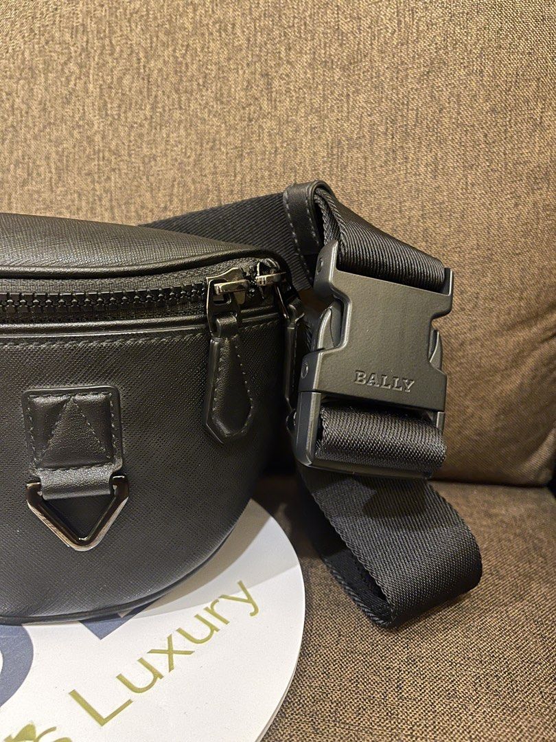 Bally Black Leather Bumbag with Red & White Stripe (Category: Luxury Bags & Wallets) located in Manila. Submitted by jnjsluxury (Listing ID 1458170532, Image 2). Description: - Authentic Bally bumbag - Color: Black leather - Features signature Bally stripe detail - Adjustable strap with branded buckle - Perfect for essentials - Clean interior - No dustbag - Includes authenticity card only Price is slightly negotiable Shipping via lalamove or grab