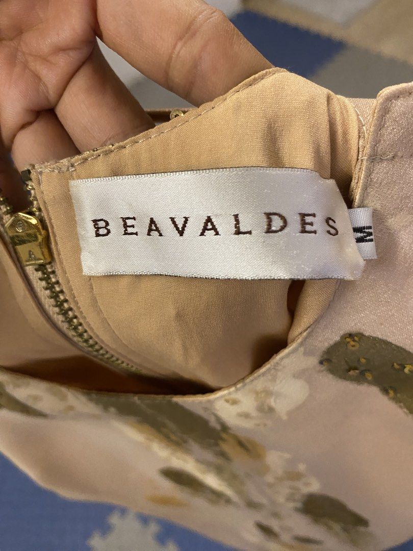 Beavaldes dress (Category: Dresses) located in Santa Rosa. Submitted by hoardqueensdeclutter (Listing ID 1457395838, Image 3). Description: - brand from a famous designer and ceo of vogue Philippines. Known for hand painted dress. - Sleeveless beige dress - Gold zipper closure at the back - Unique painted gold and white abstract pattern on the front - Subtle gold sequin details near the neckline - Medium - Ideal for parties - a filipino luxury br