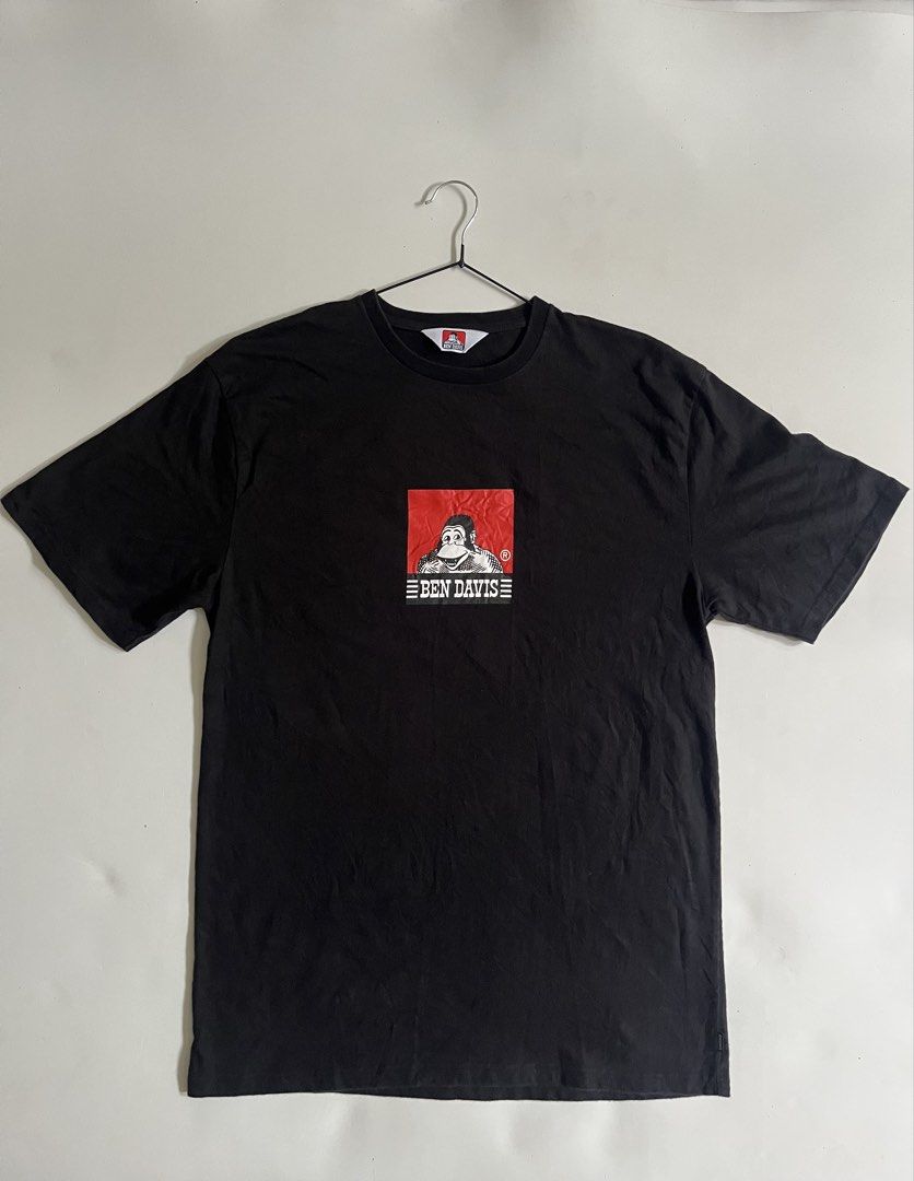 Black Ben Davis T-shirt with Monkey Logo (Category: Tshirts & Polo Shirts ) located in Aloran. Submitted by alrodferna18731 (Listing ID 1458158616, Image 1). Description: - Classic black Ben Davis t-shirt - Features the iconic monkey logo graphic on the chest - Simple crew neck, short sleeves - Great for everyday wear - Versatile and easy to style with any outfit.