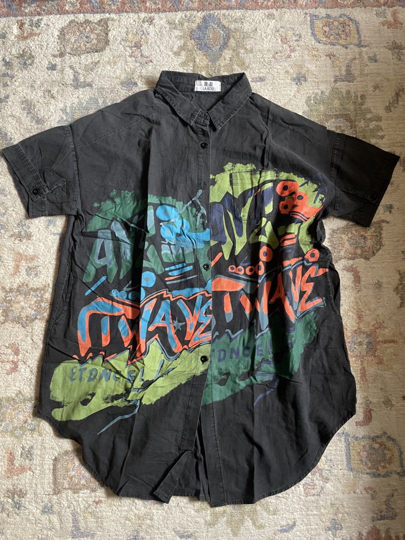 Black Graffiti Print Button-Up Shirt (Category: Tshirts & Polo Shirts ) located in Manila. Submitted by wildae (Listing ID 1458213808, Image 2). Description: Negotiable!!! - really rad print irl - has side pockets - no damages/stains Kunin niyo na.