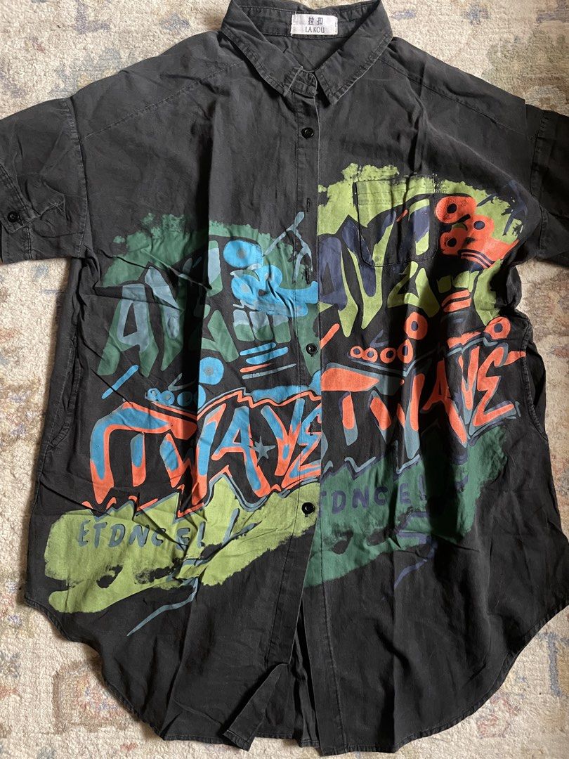 Black Graffiti Print Button-Up Shirt (Category: Tshirts & Polo Shirts ) located in Manila. Submitted by wildae (Listing ID 1458213808, Image 3). Description: Negotiable!!! - really rad print irl - has side pockets - no damages/stains Kunin niyo na.