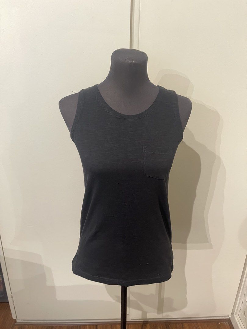 Black Sleeveless Tank Top with Pocket (Category: Sleeveless) located in Pasig City. Submitted by lovetrends1408 (Listing ID 1458190549, Image 1). Description: - Classic black tank top - Sleeveless design - Features a small chest pocket - Perfect for layering or wearing on its own - Effortlessly matches any outfit.