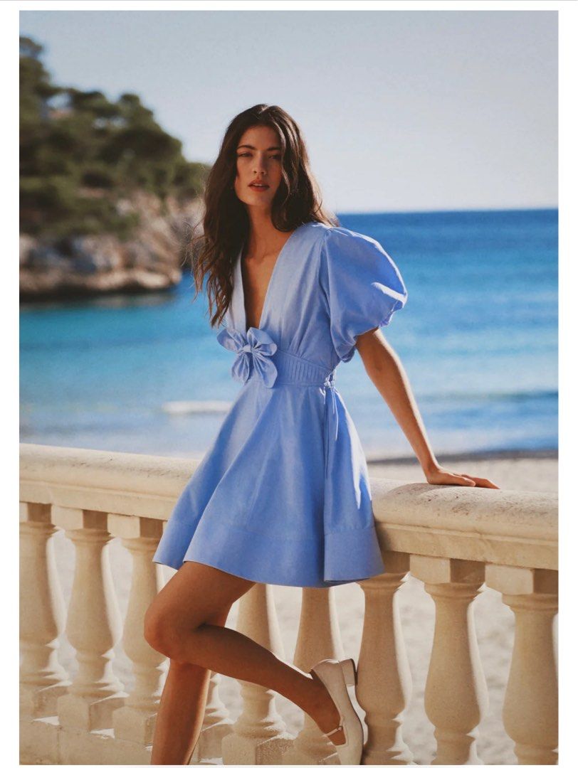 Blue Puff Sleeve Mini Dress with Bows (Category: Dresses) located in Quezon City. Submitted by bitsnbobs21 (Listing ID 1458266583, Image 3). Description: - Blue Puff Sleeve Mini Dress - similar to Morton Mac Mila Dress being sold at $390 - Features: low neckline, 2 cut out cute bows , A-line skirt - Condition: Worn once - Perfect for: Summer days, special occasions - Style: Comfortable and stylish - Fabric: Mixed Linen, comfortable in warm Philip
