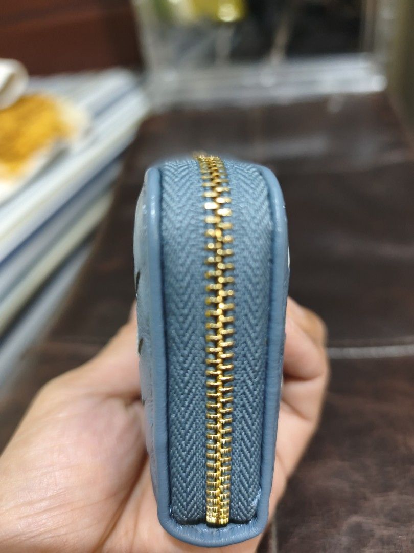 Blue Woven Leather Card Holder Wallet (Category: Wallets & Card holders) located in Quezon City. Submitted by tajima (Listing ID 1458189316, Image 3). Description: - Chic light blue card holder - Elegant woven leather exterior - Secure zipper closure - Multiple interior accordion slots for easy organization - Compact design, fits perfectly in pockets or small bags - Stylish gold-tone zipper and pull tab - Made in Italy.
