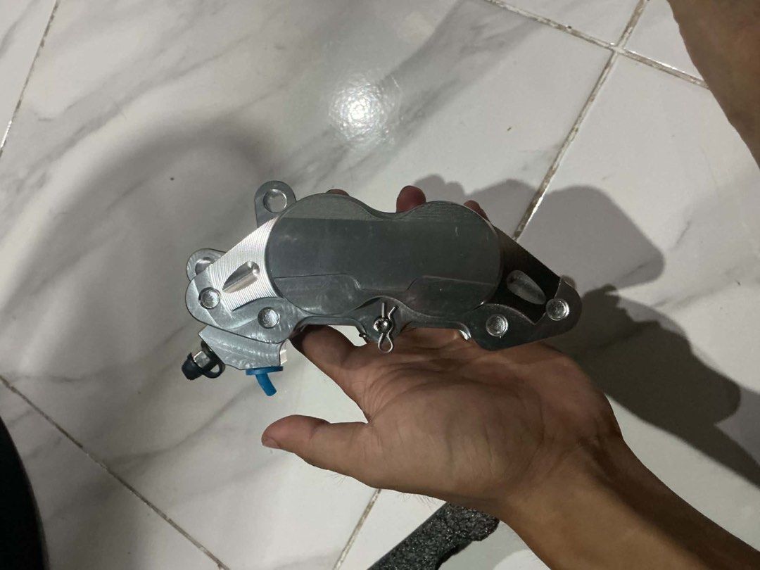 Brembo Silver Brake Caliper (Category: Construction Tools & Equipment) located in Manila. Submitted by altheaeloi27664 (Listing ID 1458119581, Image 3). Description: - Genuine Brembo brake caliper - Sleek silver finish with iconic red Brembo logo - High-performance look, perfect for motorcycles or similar vehicles - Comes complete with mounting bolts - Ready for immediate installation.