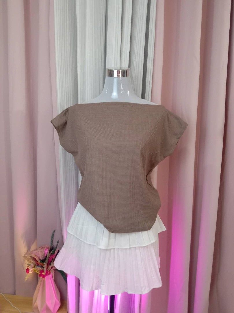 Brown Textured Off-Shoulder Top (Category: Blouses) located in Batangas. Submitted by Lerica.ph (Listing ID 1458130053, Image 1). Description: - Cute brown top - Textured waffle-like fabric - Off-shoulder neckline - Short, dolman-style sleeves - Asymmetrical hem - Versatile for casual or chic outfits.