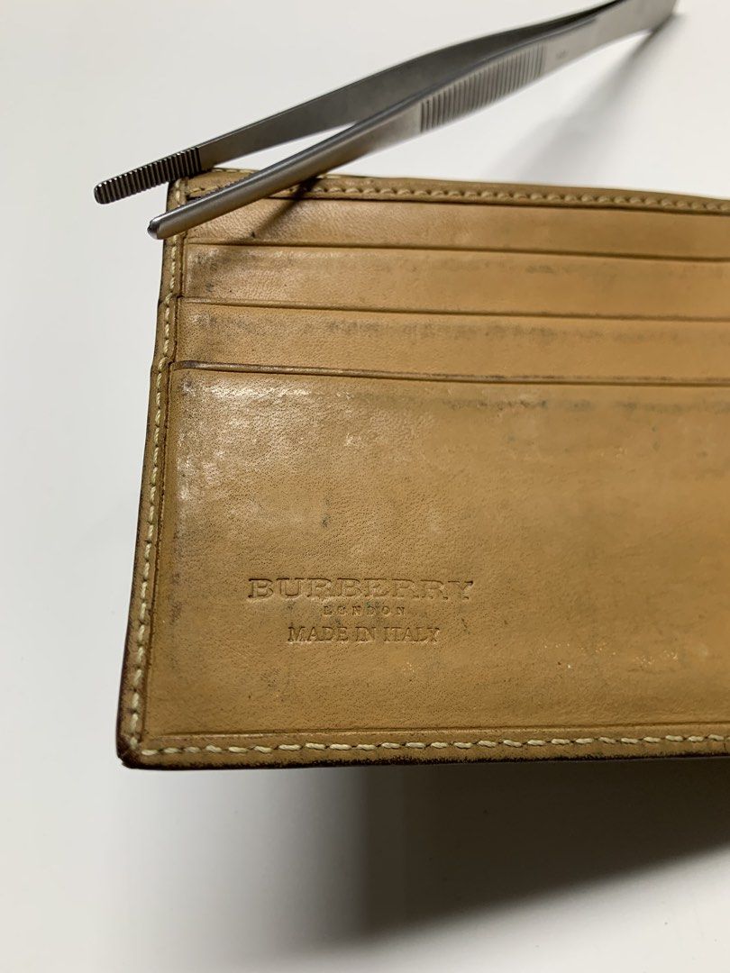 Burberry - Leather Plaid Print Bifold Wallet (Category: Wallets & Card Holders) located in Manila. Submitted by shottas_21 (Listing ID 1458218077, Image 3). Description: Burberry - Leather Plaid Print Bifold Wallet CONDITION - 8.5/10 Flaw - signs of usage - Dimensions (INCH) Height - 3.5” Width - 4”.