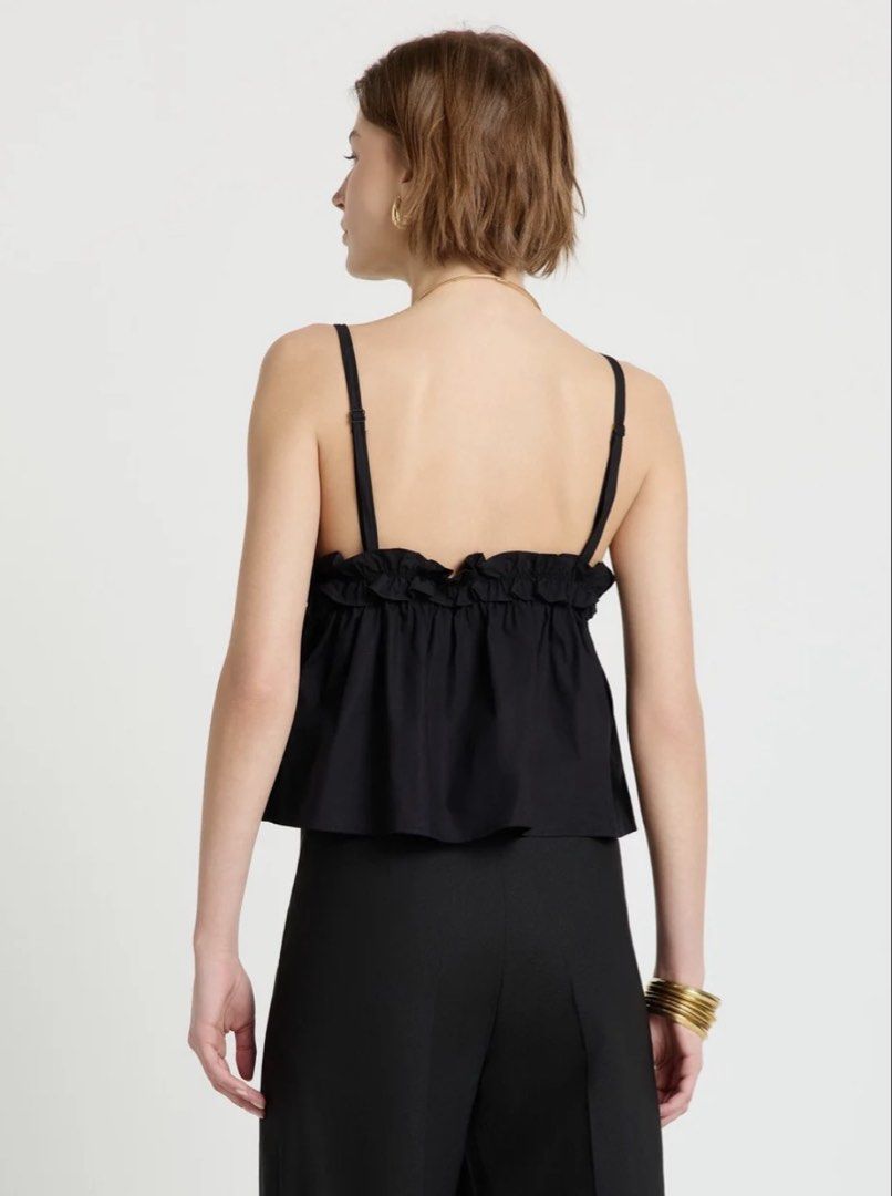 CALLIOPE Top with Ruching and Bows (Category: Sleeveless) located in Quezon City. Submitted by shesellstrinkets (Listing ID 1458251816, Image 2). Description: CALLIOPE Top Worn once V-neck and thin adjustable straps, ruching on the bust and bow details. Soft, flared shape with frills and an elastic insert under the bust. Tag says small but can fit from S to XL. Helping tags: cotton on, babydoll, cropped top, chic tops.