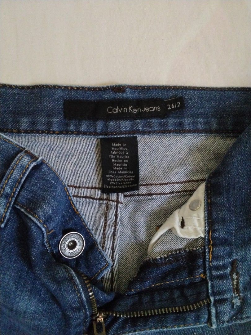 Calvin Klein Jeans short (ORIGINAL) (Category: Shorts) located in Puerto Princesa. Submitted by enjeruru (Listing ID 1458132063, Image 3). Description: Calvin Klein Jeans denim cutoff shorts featuring a medium blue wash and a distressed, raw frayed hem ORIGINAL PRICE: $70 from US🇺🇸 Size: sizing 26/2 Features: classic five-pocket styling, contrast stitching, and standard belt loops. RFS: Hindi na po kaysa sa akin... I GAINED WEIGHT 😅.