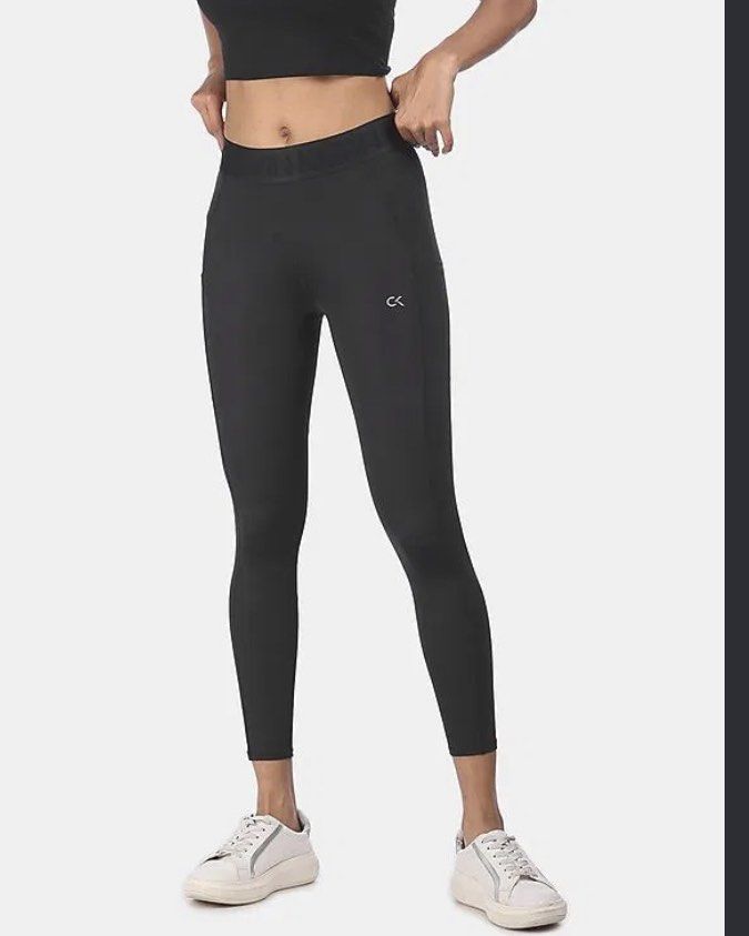 Calvin Klein Performance Black Leggings Size M (Category: Activewear) located in Naga. Submitted by cozydapper (Listing ID 1458146886, Image 1). Description: - Black Calvin Klein Performance leggings - Features iconic CK logo on left thigh - "Calvin Klein" branding on the waistband - Made in Vietnam - Ideal for workouts, gym sessions, or casual everyday wear.