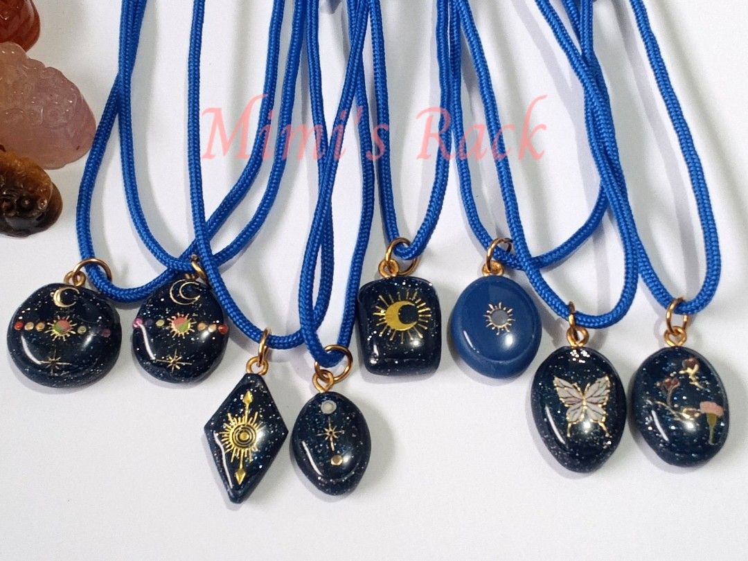 Celestial Decoupage Pendant Necklace (Category: Necklaces) located in Taguig. Submitted by mimisrack (Listing ID 1458266352, Image 2). Description: 💙Beautiful handmade-style pendant necklaces featuring dark blue celestial designs with gold-tone details, colorful accents, and a matching blue cord. ✨💙 -Each pendant has its own unique design—from moons and stars to sun motifs, butterflies, and floral details—so you can choose the one that matches 