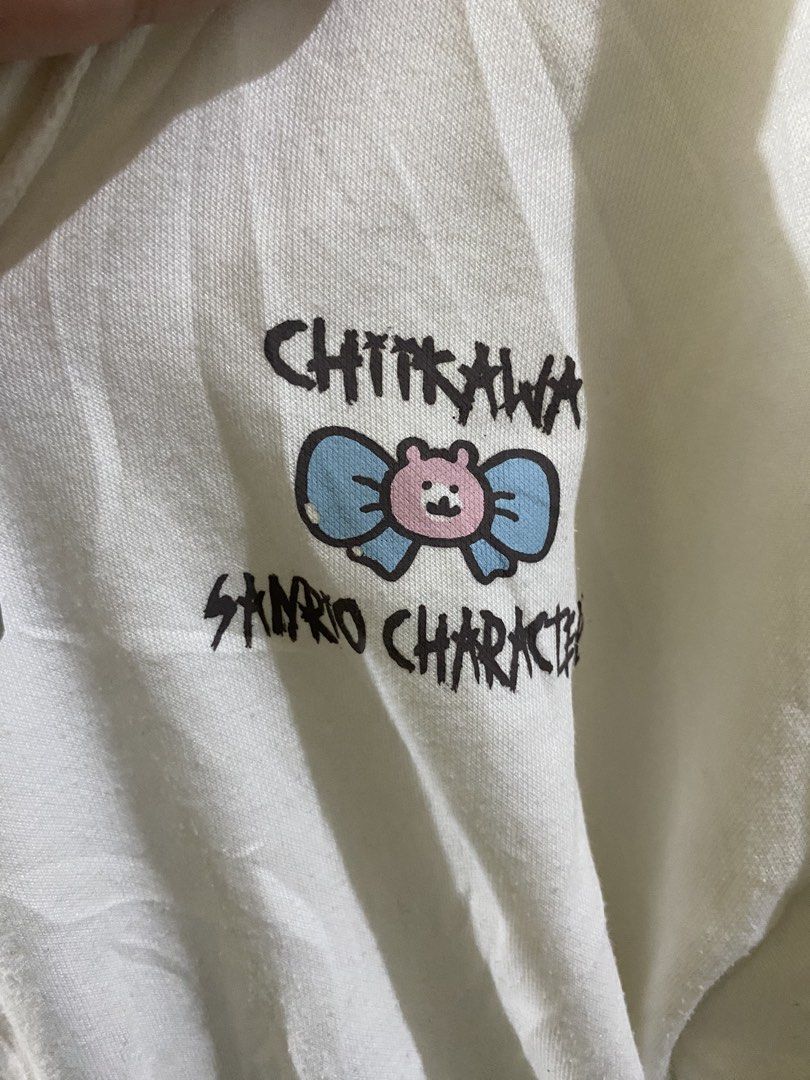 Chiikawa x Sanrio Characters Collaboration (Category: Hoodies) located in Imus. Submitted by mnmv23 (Listing ID 1458146898, Image 2). Description: Chiikawa x Sanrio Characters Collaboration - Chiikawa My Melody Nagano Half-zip hoodie, white, long sleeves, with hood. Size M - may minimal print chip, check pics nalang po. Not sure if ganun talaga sya or issue - needs wash - size medium pero runs big sya.