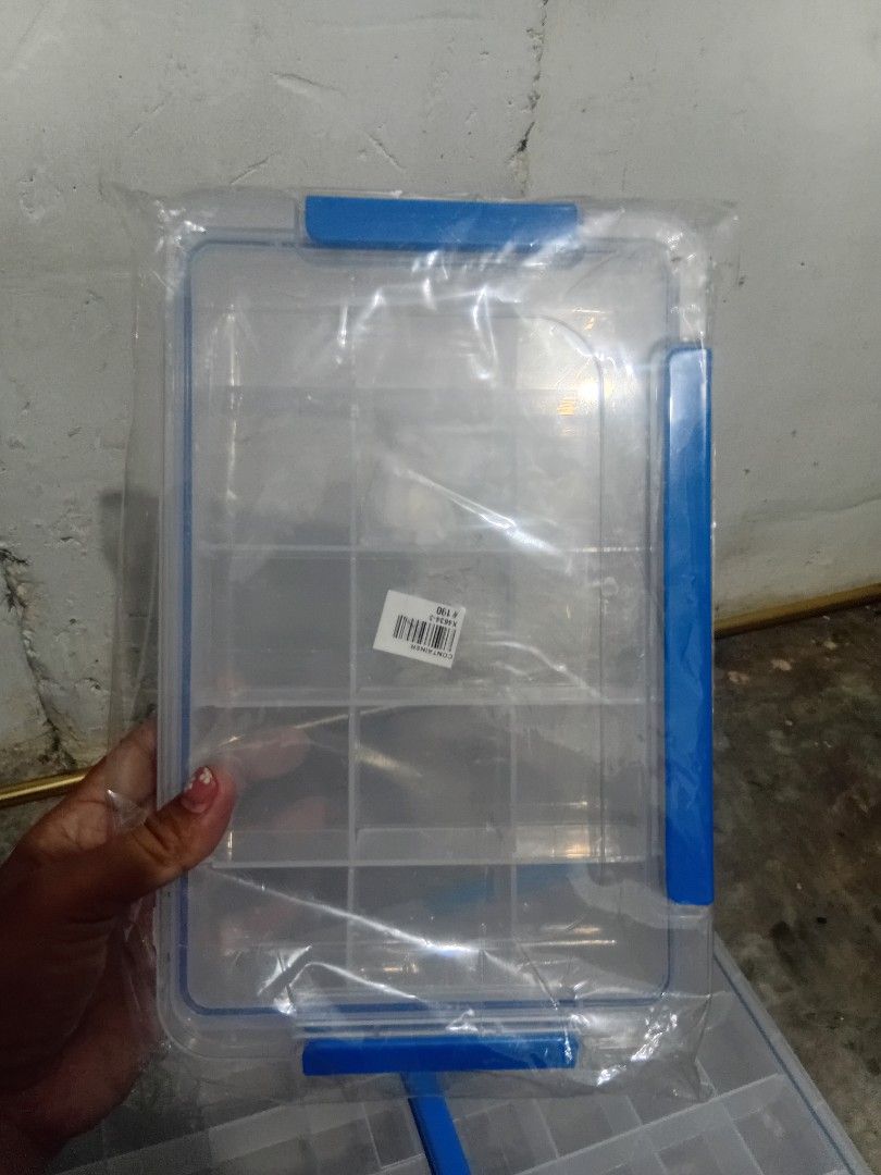 Clear Plastic Storage Box with Blue Clasps (Category: Storage Boxes & Baskets) located in Manila. Submitted by pc_melodypearl (Listing ID 1458117870, Image 3). Description: - Clear organizer box with multiple compartments - Ideal for beads, craft supplies, hardware, and other small items - Secure blue clasps on the sides - Stackable design for space-saving storage - Keeps your space tidy and organized.