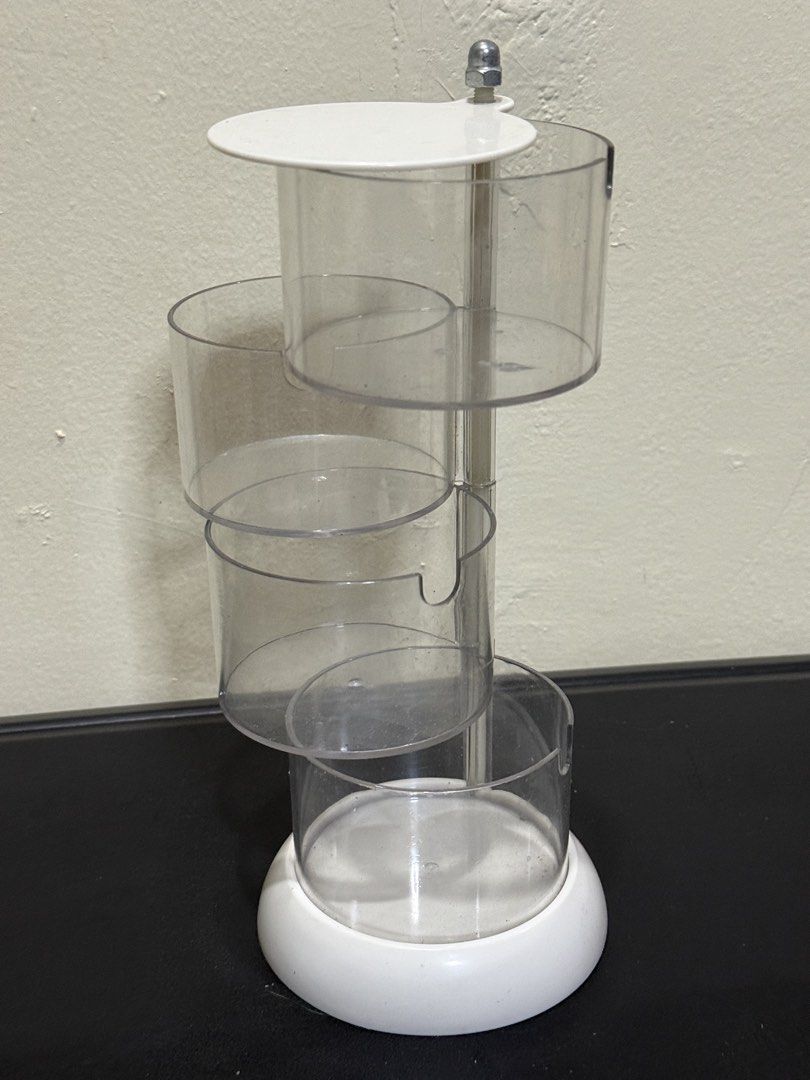 Clear Rotating 3-Tier Storage Organizer Stand (Category: Storage Boxes & Baskets) located in Manila. Submitted by gooddealsmanila (Listing ID 1458280242, Image 2). Description: - 3-Tier Rotating Storage Organizer - White, round base - Ideal for organizing small items on desks or vanities - Keeps items tidy and easily accessible - Smooth spinning action for convenient retrieval.