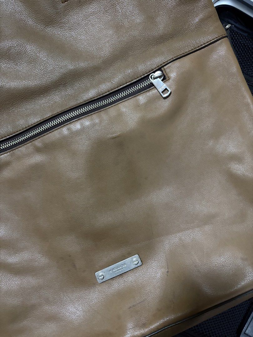 Coach 71184 Thompson Leather Foldover Tote (Category: Luxury Bags & Wallets) located in Quezon City. Submitted by rv1995 (Listing ID 1458130323, Image 2). Description: COACH Men’s Thompson Leather Foldover Tote Bag - Warm Tan / Cognac (71184) Selling an authentic Coach Thompson Foldover Tote (Style No. 71184). Crafted from high-quality, glove-tanned leather in a rich warm tan/cognac shade with dark brown handles and silver-tone hardware. This ver