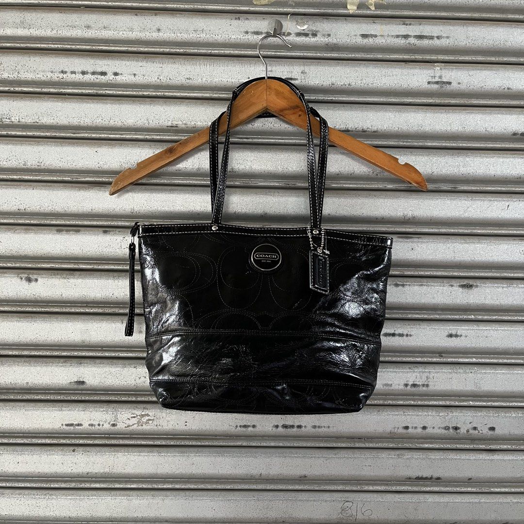 Coach Black Patent Leather Monogram Tote Bag (Category: Luxury Bags & Wallets) located in Sagbayan (Borja). Submitted by lunapawpaw46843 (Listing ID 1458194423, Image 1). Description: - Authentic Black Coach Tote Bag - Luxurious Patent Leather with Embossed Monogram - Elegant White Stitching Details - Shiny Silver Hardware - Iconic Coach Logo and Hangtag - Secure Zipper Closure - Ideal Everyday Bag.