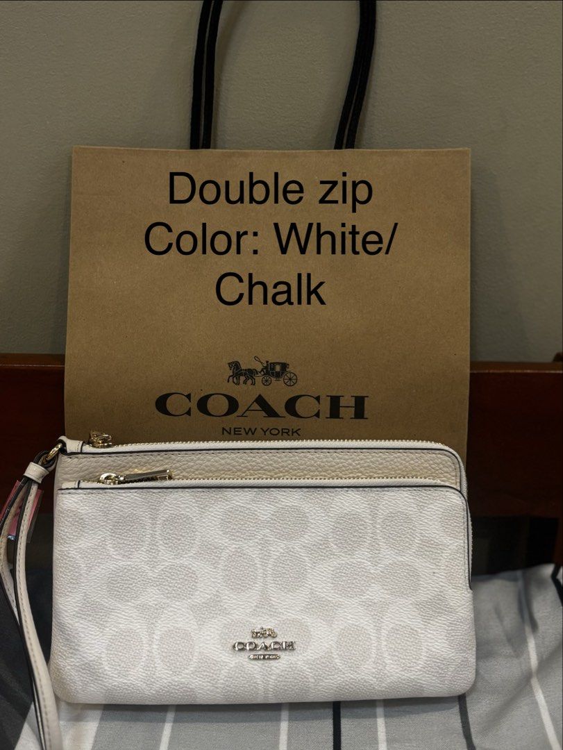 Coach Double Zip Wristlet - White/Chalk & Tan/Brown (Category: Purses & Pouches) located in Cainta. Submitted by cally711 (Listing ID 1458109430, Image 1). Description: - Two Coach Double Zip Wristlets - Available in White/Chalk with Signature C pattern - Available in Tan/Brown with Signature C pattern - Each includes a detachable wrist strap - Ideal for organizing essentials - Can be used as a small clutch.