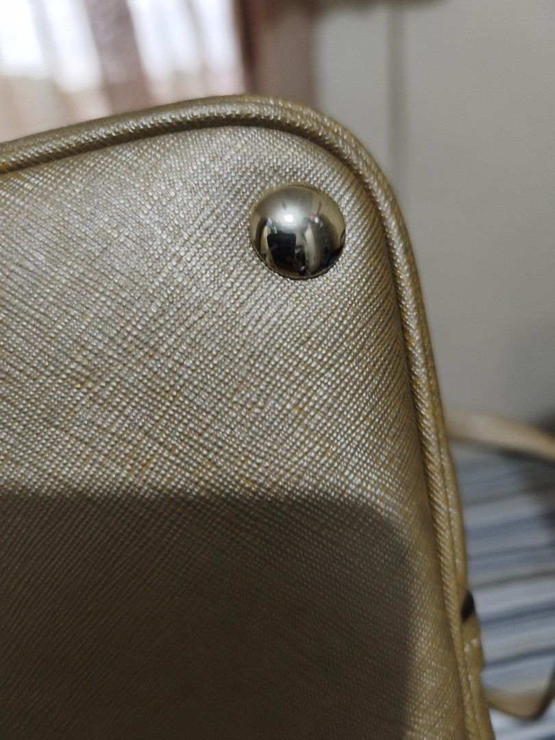 Coach Gold Textured Leather Satchel Bag (Category: Shoulder Bags) located in Quezon City. Submitted by tajima (Listing ID 1458101822, Image 1). Description: - Authentic Coach gold textured leather satchel bag - Features signature Coach hangtag - Protective metal feet on the bottom - Secure top zipper closure - Two comfortable top handles - Convenient front slip pocket - Ideal for everyday use.