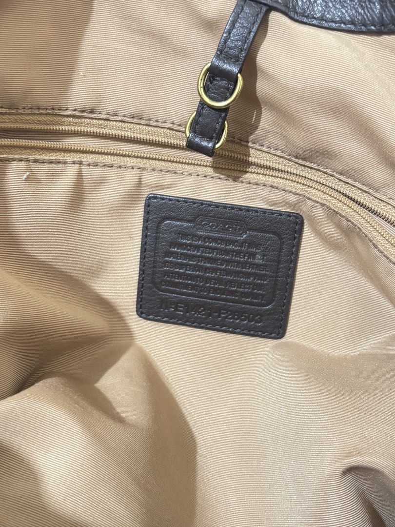 Coach Monogram Canvas Leather Trim Shoulder Bag (Category: Luxury Bags & Wallets) located in Manila. Submitted by shyshai_ (Listing ID 1458209635, Image 3). Description: - Classic Coach shoulder bag - Signature monogram canvas - Black leather trim - Green stripe detail - Tan fabric lining - Spacious interior - Gold hardware accents - Ideal for everyday use.