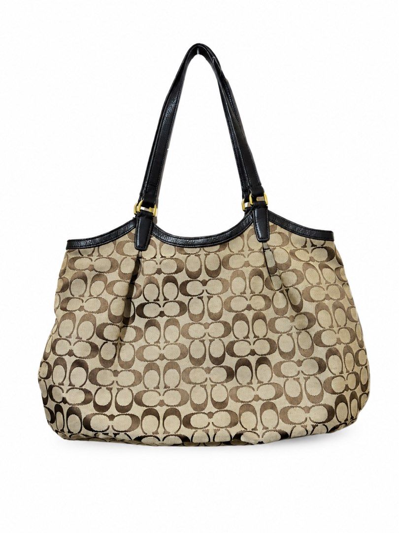 Coach Monogram Canvas Leather Trim Shoulder Bag (Category: Luxury Bags & Wallets) located in Manila. Submitted by shyshai_ (Listing ID 1458209635, Image 2). Description: - Classic Coach shoulder bag - Signature monogram canvas - Black leather trim - Green stripe detail - Tan fabric lining - Spacious interior - Gold hardware accents - Ideal for everyday use.