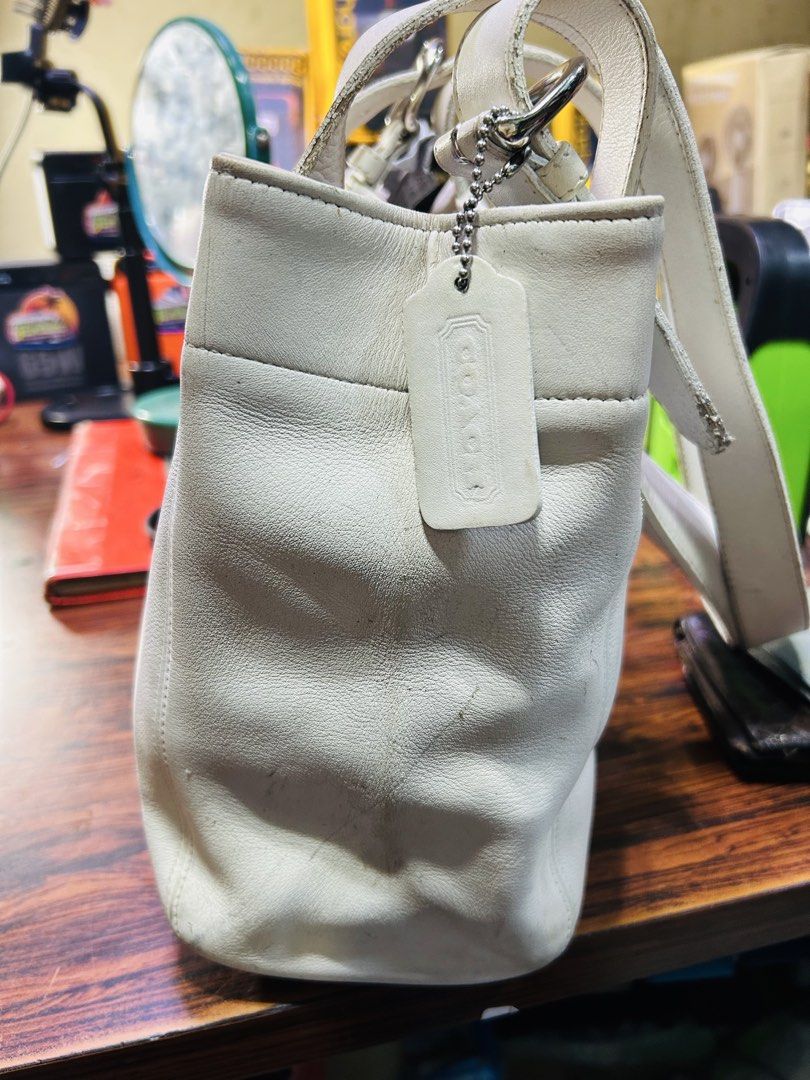 Coach White Leather Tote Bag (Category: Luxury Bags & Wallets) located in Manila. Submitted by starbalesukandjapansurplus (Listing ID 1458003423, Image 3). Description: - Authentic Coach white leather tote bag - Classic and versatile design - Comfortable shoulder straps with buckle detail - Features an interior zip pocket for secure storage - Ideal for everyday wear and carrying essentials.