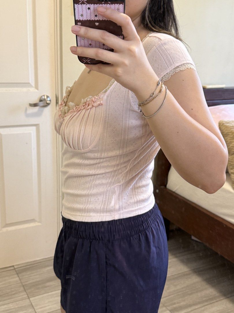Coquette lace top in pink (Category: Others Tops) located in Bacolor. Submitted by alysaflrs (Listing ID 1458197387, Image 3). Description: ★never worn ★ their best seller ★brand new!! ★bought this in vietnam for ₱1,249 ★super love the details 🥹💞 ★flattering neckline ★best fit for size S and M ★vietnam brand.