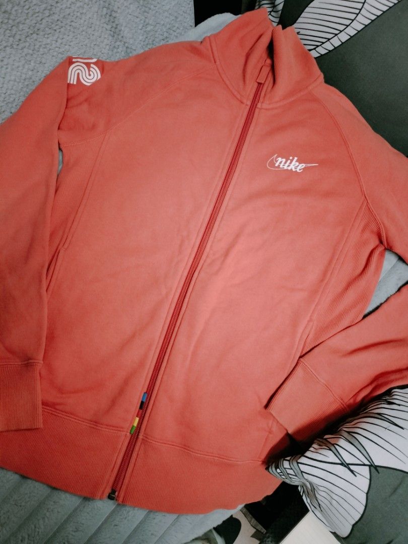 Coral Pink Nike fleece Jacket (Category: Coats, Jackets and Outerwear) located in Manila. Submitted by cyn.declutters (Listing ID 1458170112, Image 1). Description: Nike logo on the chest and graphic detail on the sleeves size XL dimes 19" 24.