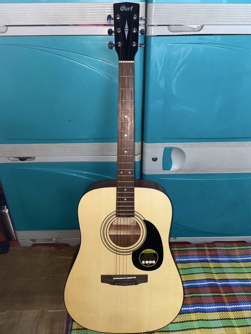 Cort AD810E Standard Acoustic Guitar (Category: Musical Instruments) located in Taguig. Submitted by missgirladdict (Listing ID 1458142185, Image 2). Description: bought by my father for me and just stored after buying/ impulse buy no time matuto as in hindi nagamit natambak lang Bought sa physical store, offer nlng kayo dk hm this will cost na but no to lowballers nmn dahil no signs of usage ito With bag, dm for more pics / concerns.