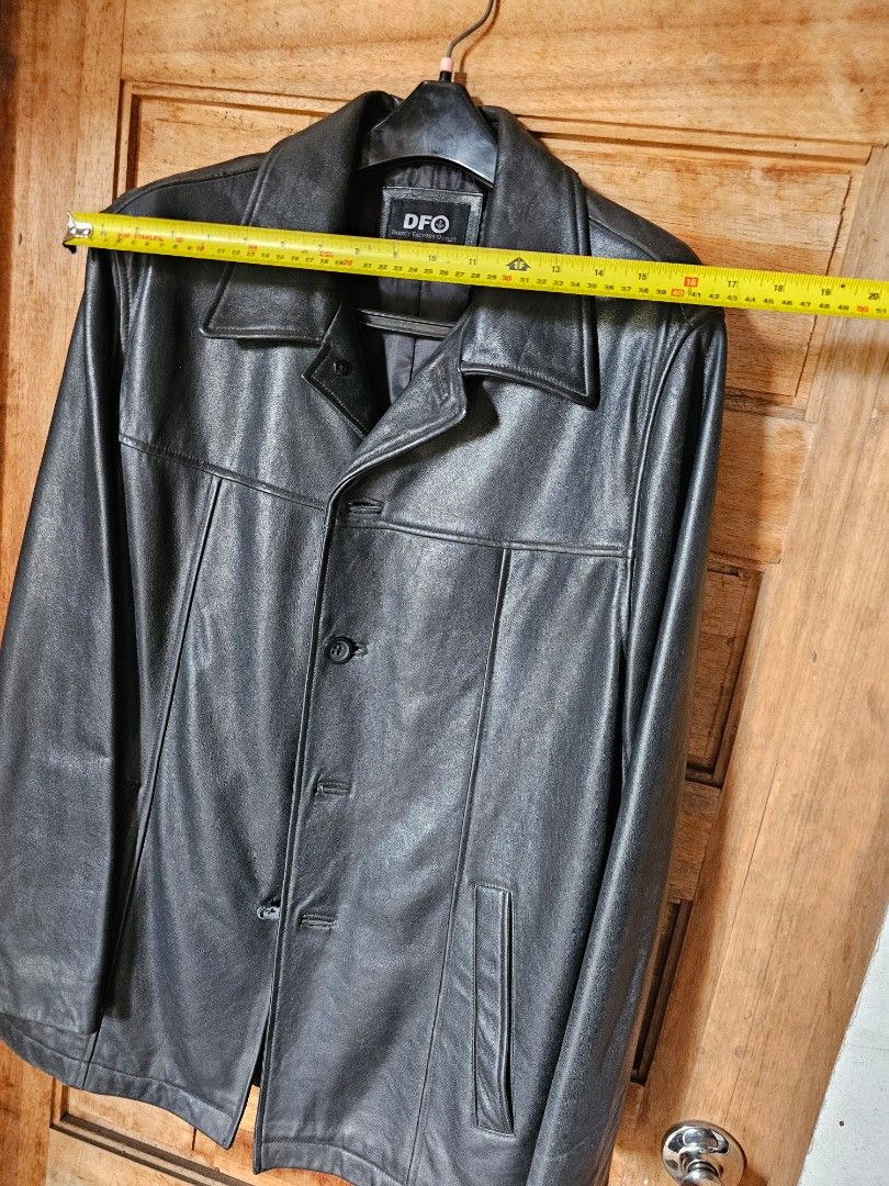 DFO Black Leather Jacket Men's Size M (Category: Coats, Jackets and Outerwear) located in Tagbilaran City. Submitted by lugarpogi (Listing ID 1458158993, Image 3). Description: - Classic black genuine leather jacket from DFO - Button-up front with a collared neckline - Two chest pockets and two side pockets - Fully lined interior - Genuine leather construction - Versatile for layering or wearing solo.