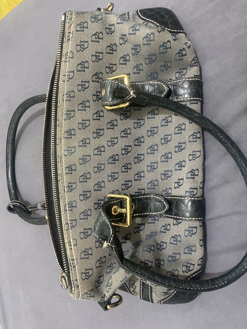 Dooney & Bourke Satchel Bag (Category: Luxury Bags & Wallets) located in Manila. Submitted by fiercefire_ec9997 (Listing ID 1458102315, Image 1). Description: - Classic Dooney & Bourke satchel - Signature DB pattern all over - Black leather trim and handles - Gold hardware details - Interior branded tag and serial number tag - Zipper closure - Great everyday bag.