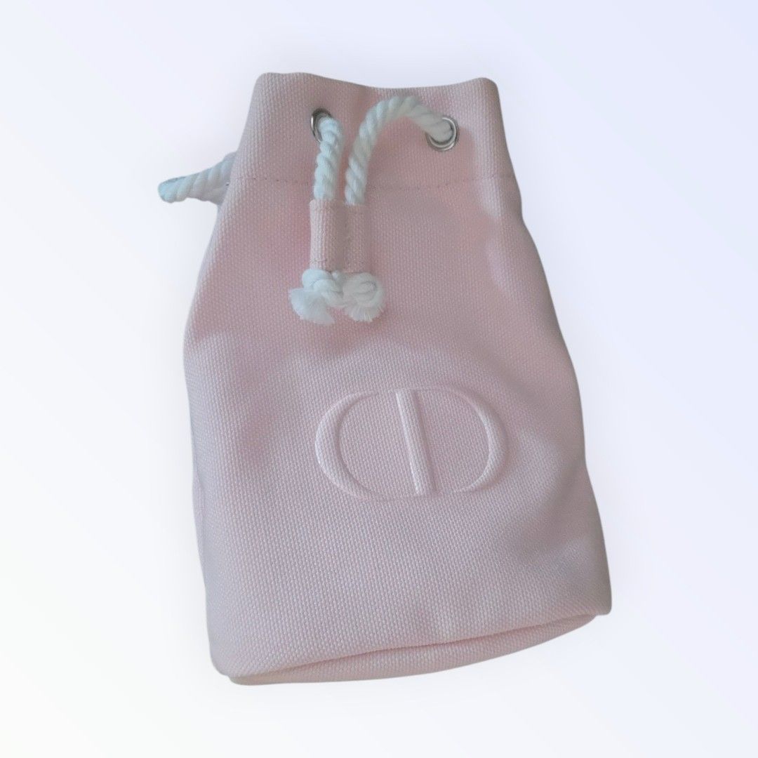 Drawstring Pouch (Category: Purses & Pouches) located in Singapore. Submitted by letzbag (Listing ID 1458189417, Image 3). Description: - Brand: Dior - Item: Drawstring Pouch - Color: Pastel Pink - Features: Embroidered Dior CD logo, drawstring closure - Includes: Original Dior box -GWP from Dior Fragrance, Beauty.