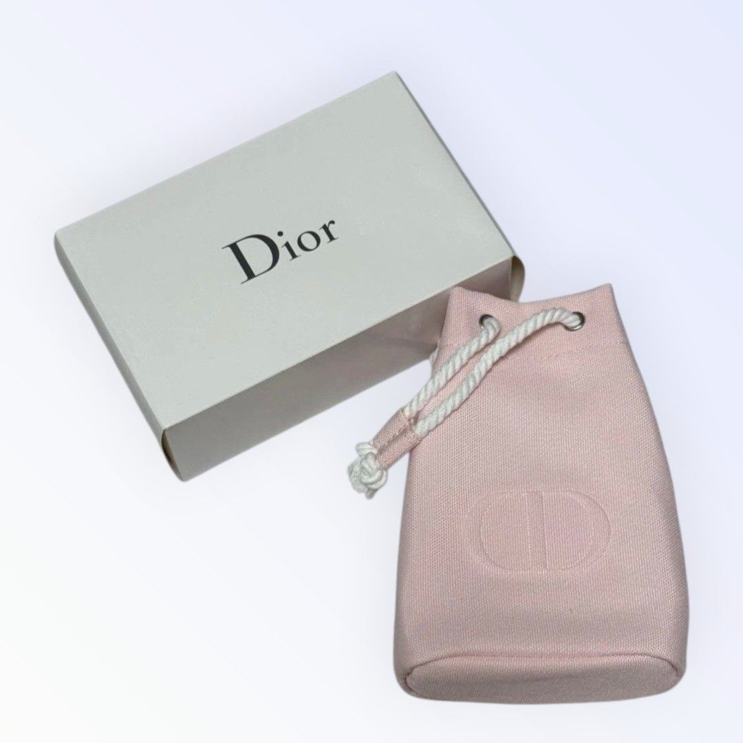 Drawstring Pouch (Category: Purses & Pouches) located in Singapore. Submitted by letzbag (Listing ID 1458189417, Image 1). Description: - Brand: Dior - Item: Drawstring Pouch - Color: Pastel Pink - Features: Embroidered Dior CD logo, drawstring closure - Includes: Original Dior box -GWP from Dior Fragrance, Beauty.