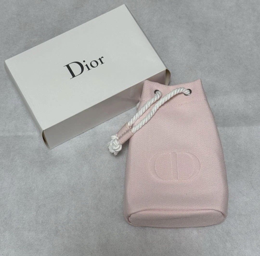 Drawstring Pouch (Category: Purses & Pouches) located in Singapore. Submitted by letzbag (Listing ID 1458189417, Image 2). Description: - Brand: Dior - Item: Drawstring Pouch - Color: Pastel Pink - Features: Embroidered Dior CD logo, drawstring closure - Includes: Original Dior box -GWP from Dior Fragrance, Beauty.