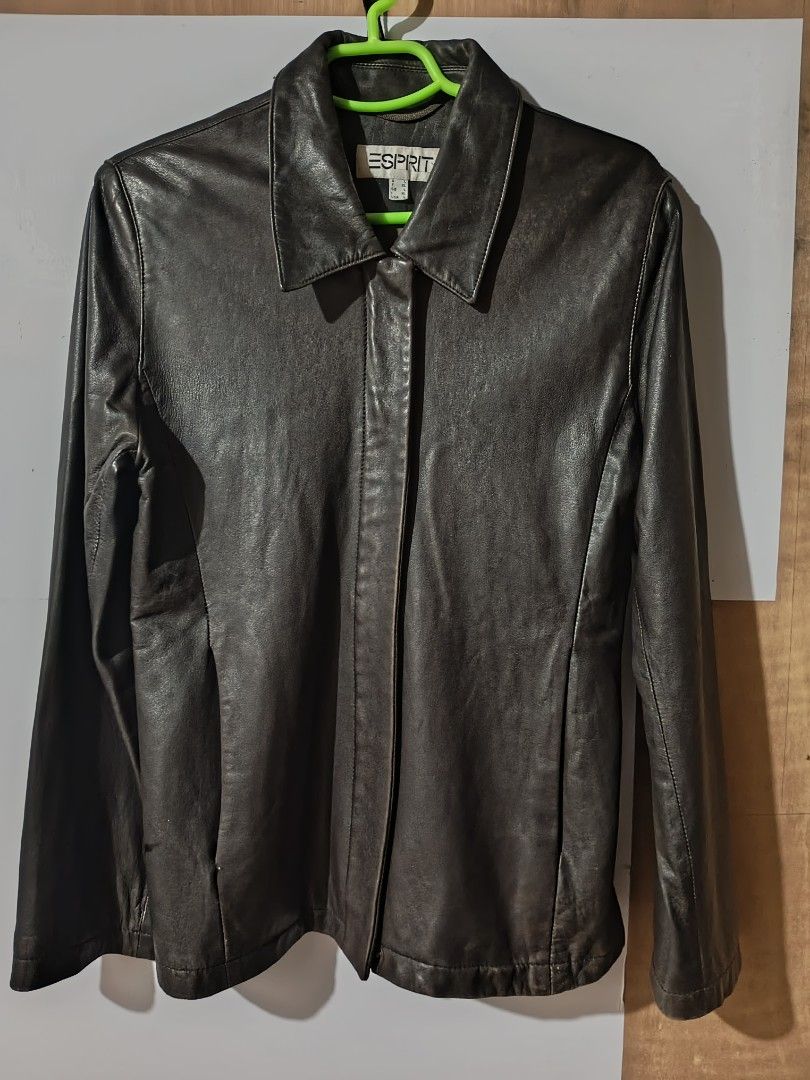 Esprit Leather Jacket (Category: Coats, Jackets and Outerwear) located in Makati City. Submitted by elirei (Listing ID 1458124520, Image 1). Description: - Esprit brown leather jacket - Classic collar and button-up front - Two side pockets - Estimated size L - Ideal for cooler weather - Versatile addition to any wardrobe -Real leather nice fit when worn, also idk why it's too textured in the photo perp it looks nice in person.