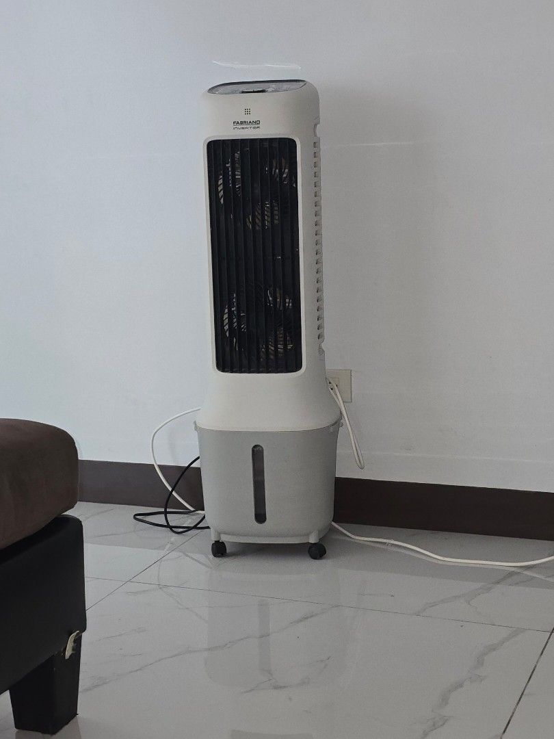Fabriano Tower Fan Cooler (Category: Fans) located in Pasay City. Submitted by hdraf (Listing ID 1458208191, Image 1). Description: - Tower fan with built-in cooler function - Color: White and Grey - Features a convenient water tank on the side - Excellent working condition, effectively cools down rooms - Equipped with wheels for easy portability and movement.