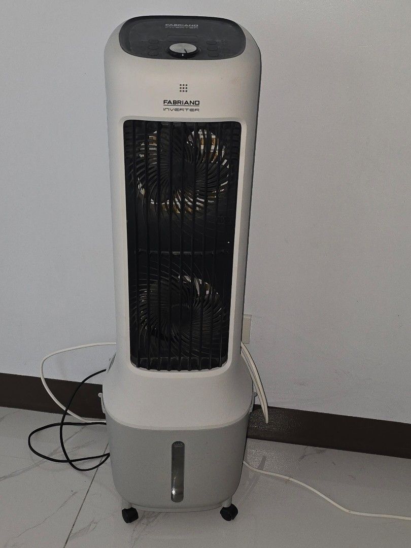 Fabriano Tower Fan Cooler (Category: Fans) located in Pasay City. Submitted by hdraf (Listing ID 1458208191, Image 2). Description: - Tower fan with built-in cooler function - Color: White and Grey - Features a convenient water tank on the side - Excellent working condition, effectively cools down rooms - Equipped with wheels for easy portability and movement.