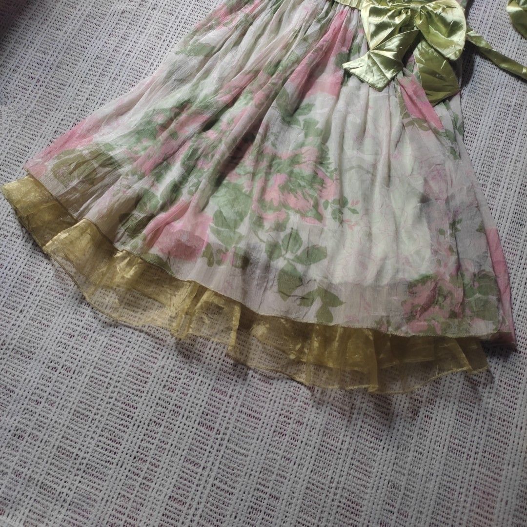 Fairy Floral Ruffled Whimsy Dress (Category: Dresses) located in Iligan City. Submitted by youngogs (Listing ID 1458252432, Image 3). Description: small - medium - Light and airy floral dress - Delicate pink and green floral print on white - Comes with a matching satin ribbon belt - Layered hem with sheer gold overlay flaws: unnoticeable loose stitch ( see photos ).