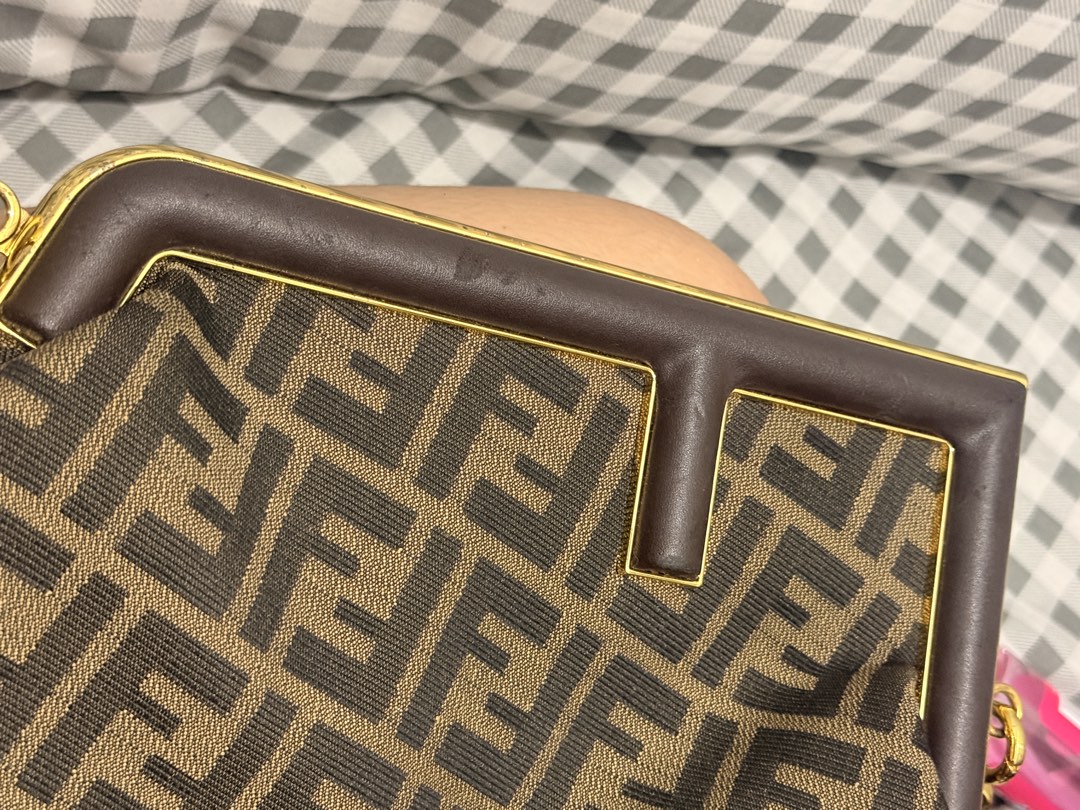 Fendi First Bag Monogram (Category: Luxury Bags & Wallets) located in Manila. Submitted by cleverrabbit-bd01 (Listing ID 1458270842, Image 3). Description: 👜 Fendi First Bag — Brown FF Jacquard FOR SALE — FENDI FIRST BAG 🤎 Fendi First bag in Brown FF Jacquard with leather details and gold-tone hardware. ✨ Condition: Good pre-loved condition • Overall well-maintained • Minor scratches/wear on the leather handle • Minor peeling on some leather ar