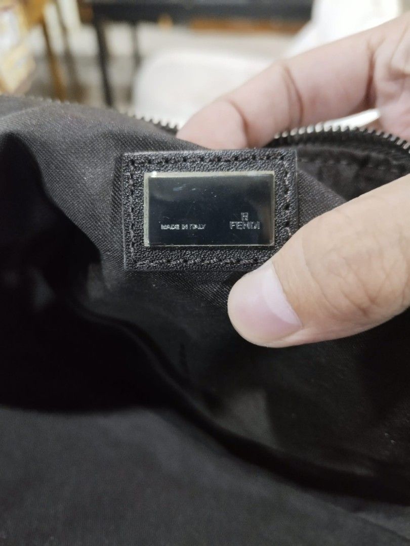 Fendi Zucca Canvas Mini Baguette Shoulder Bag (Category: Luxury Bags & Wallets) located in Gapan. Submitted by cleverstar.36492b (Listing ID 1458183089, Image 3). Description: Authentic Fendi mini baguette bag. Classic Zucca canvas pattern. Zipper closure. Interior has a small tag with serial number 2255.8BR144.029. Made in Italy. Small and compact, great for essentials. Handle is black leather..