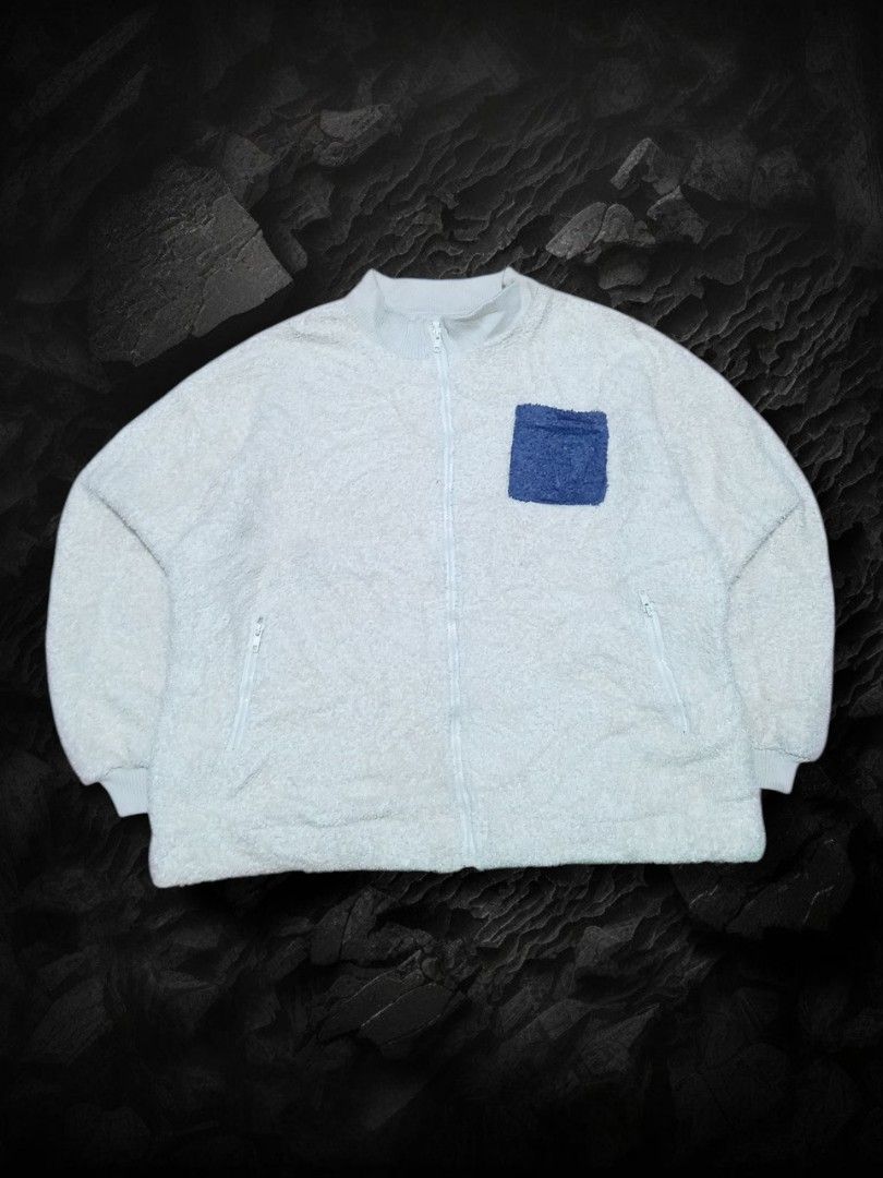Fluffy Zip-Up Jacket "Bunny Fluffy" (Category: Coats, Jackets and Outerwear) located in Aguinaldo. Submitted by baguioukayukay2600 (Listing ID 1458179630, Image 2). Description: - Super soft and fluffy zip-up jacket - Light blue color with a fuzzy texture - Chest pocket and two side zip pockets - "Bunny Fluffy" embroidered on the back - Ideal for staying cozy and comfortable.