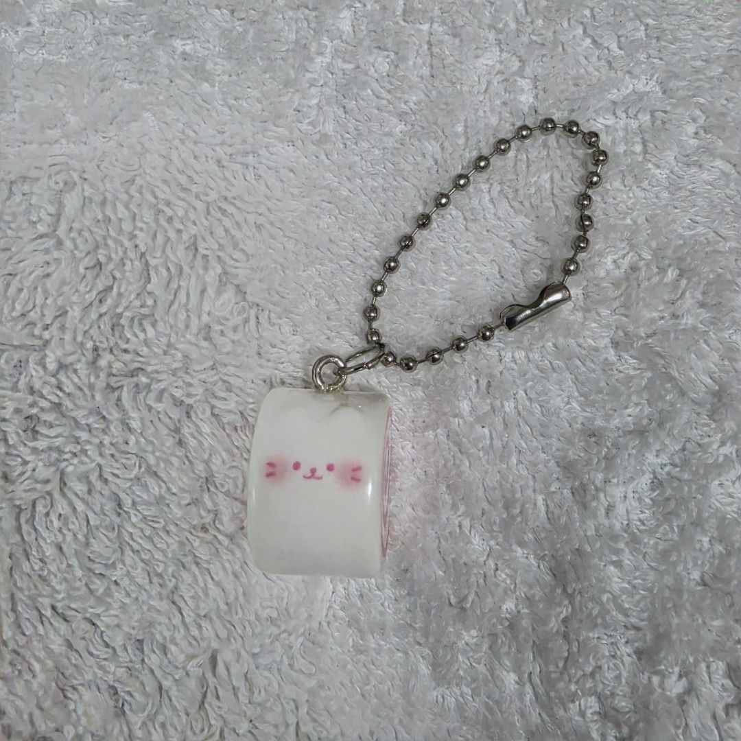 Foodie Charm Fish Cake (Category: Designer & Blind Box Toys) located in Pasig City. Submitted by aerasdrafts (Listing ID 1458284713, Image 2). Description: This capsule toy keychain represents a Narutomaki (Japanese cured fish cake) reimagined with a cute anime character design..