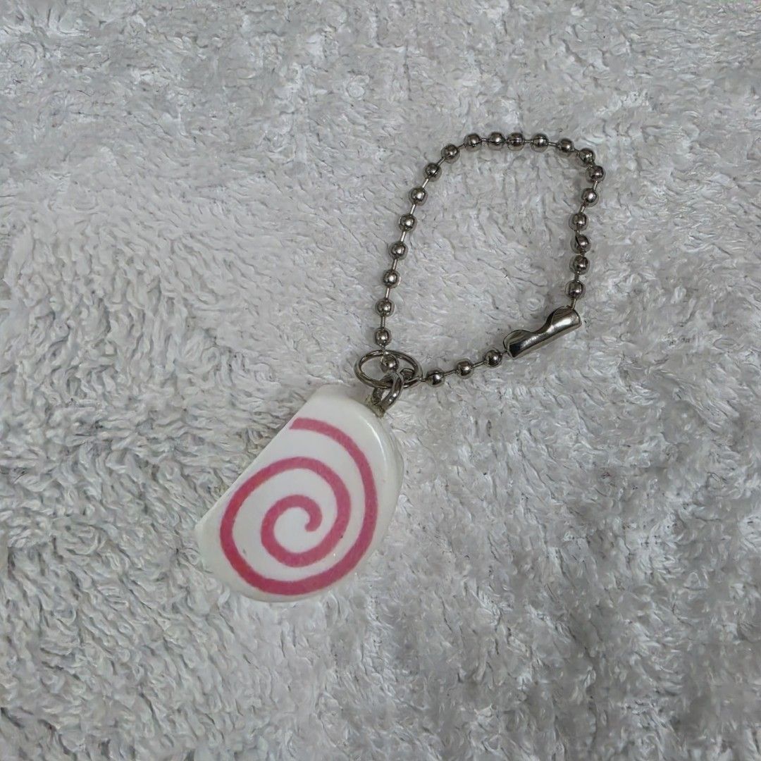 Foodie Charm Fish Cake (Category: Designer & Blind Box Toys) located in Pasig City. Submitted by aerasdrafts (Listing ID 1458284713, Image 1). Description: This capsule toy keychain represents a Narutomaki (Japanese cured fish cake) reimagined with a cute anime character design..
