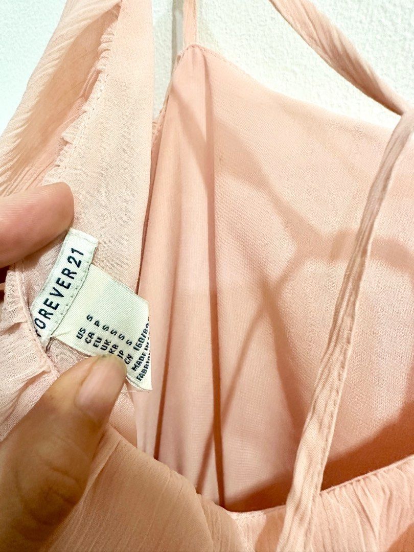 Forever 21 Pink Chiffon Ruffle Spaghetti Strap Dress (Category: Dresses) located in Quezon City. Submitted by decluttering_alot (Listing ID 1458112295, Image 3). Description: - Light pink chiffon dress - Spaghetti straps - Tiered ruffle overlay on bodice - Tie at the waist - High-low hemline - Ideal for casual outings or summer events - Comfortable and easy to wear, super prety! like zara love bonito Size: Small RFS: closet cleanup.