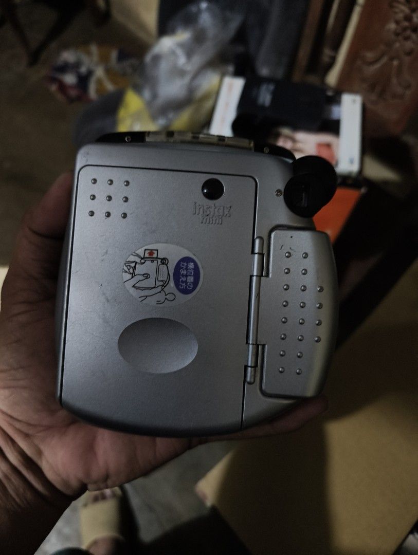 Fujifilm Instax Mini 20 Silver Instant Camera (Category: Cameras) located in Bauang. Submitted by jerwinpere15921 (Listing ID 1458224078, Image 2). Description: - Fujifilm Instax Mini 20 instant camera - Shows minor scuffs from normal use untested no cr2 battery as is .