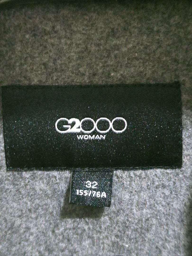 G2000 Women's Trench Coat (Category: Coats, Jackets and Outerwear) located in Quezon City. Submitted by mcmp1216 (Listing ID 1458162701, Image 2). Description: Excellent condition like new 💯 Ready to wear, dry cleaned. Gray wool-blend coat featuring notch lapels and side pockets. G2000 brand label on the inner collar. Small to medium petite body size..