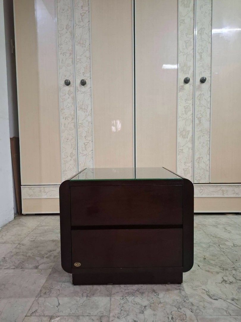 Glass Top Side Table Drawer Nightstand (Category: Tables & Sets) located in Quezon City. Submitted by dannikkishoppe2 (Listing ID 1458111983, Image 2). Description: Glass Top Side Table Drawer Nightstand ‼️₱4800‼️ *in good condition Please manage your expectations as there might be minimal flaws. Color may vary due to lighting, it may appear darker or lighter in person. Check photos first before buying. Please refrain from purchasing if you are p